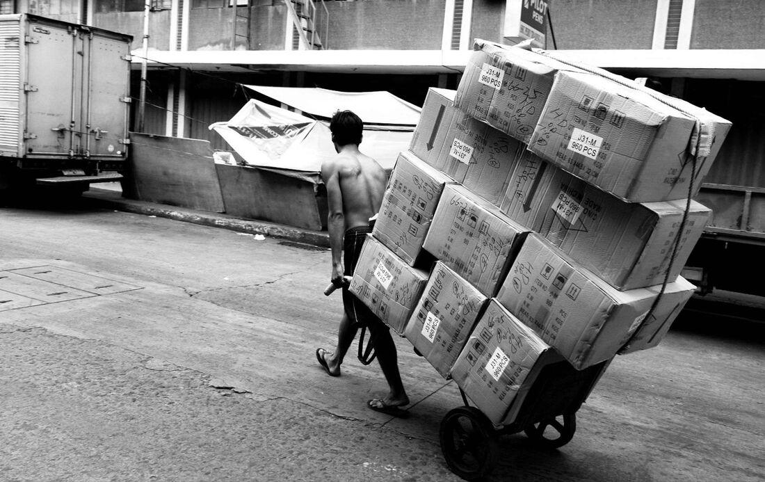A van packed with labelled stackable crates ready for the journey