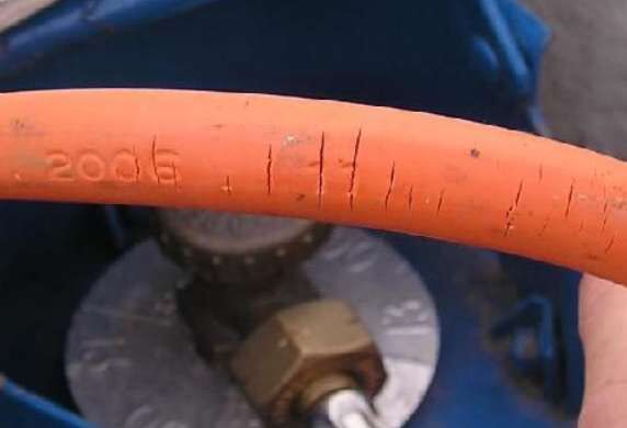 Perished, cracked old gas hose