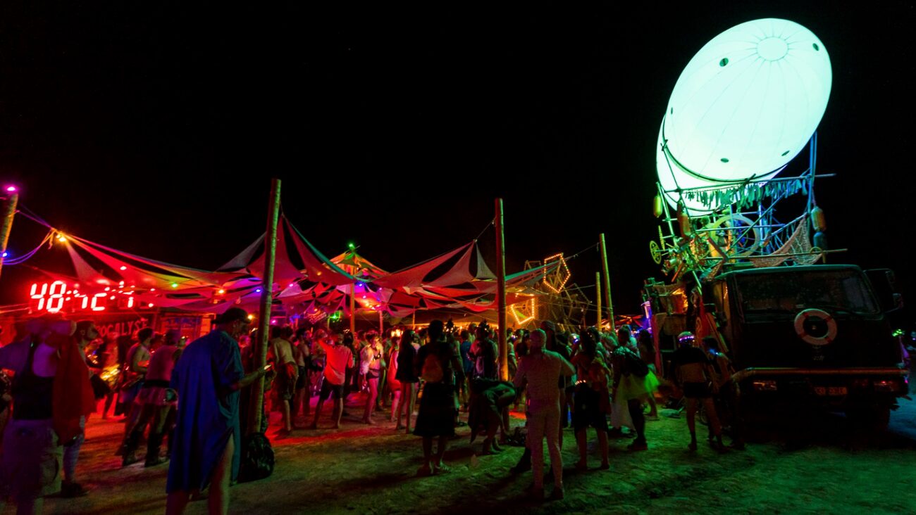 Glowing neon art installation in the desert at night